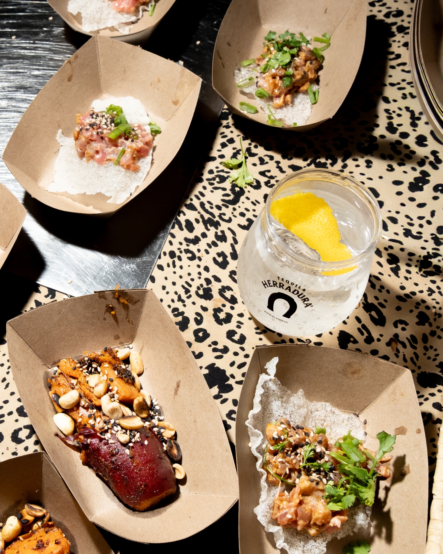 Tasting trays with tuna tartare and Herradura cocktail